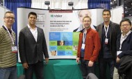 Team in front of booth