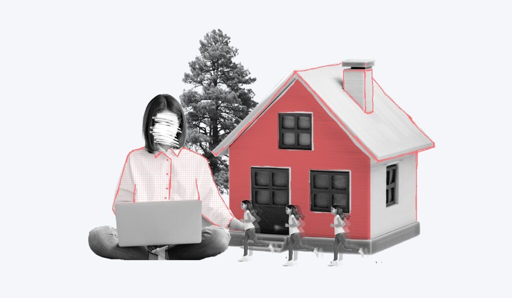a woman sitting cross legged with a laptop in front of a house and children running around